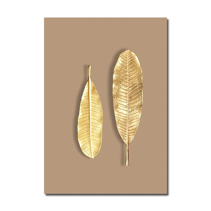 Two gold leaf-shaped decorations on a beige background