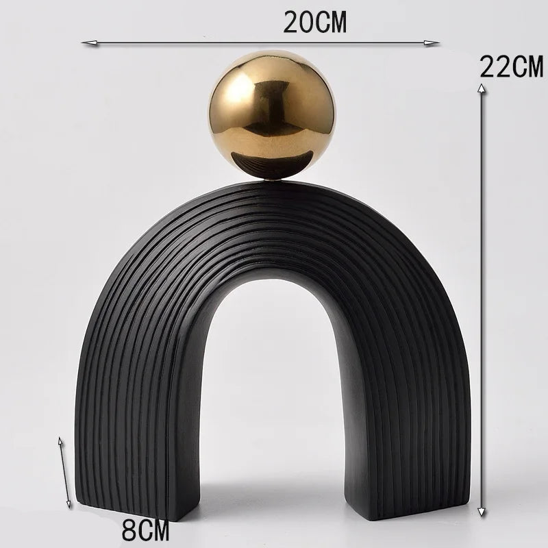 Decorative object with a black arch and gold sphere, shown with measurements on a white background.