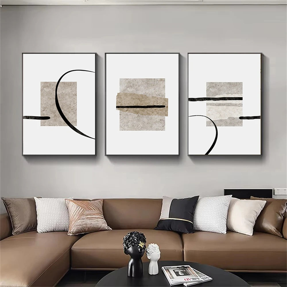 Three abstract art pieces on a wall above a brown sectional sofa.