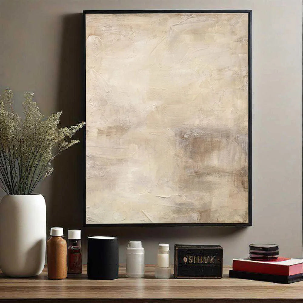 Abstract art piece on a wall with decorative items on a shelf below.