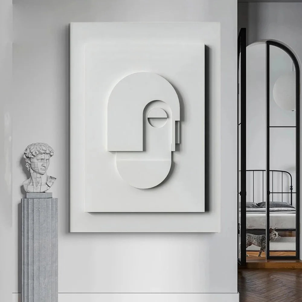 Abstract wall art piece on a white wall with a bust and mirror in the background.