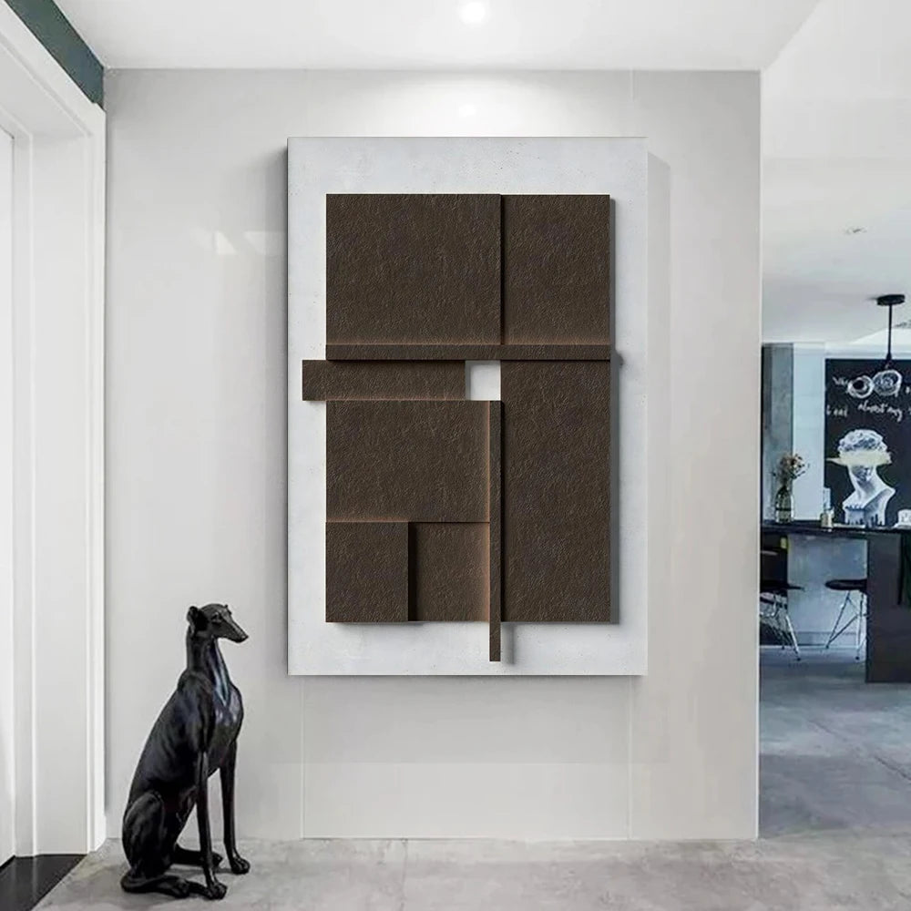 Abstract wall art piece on a white wall with a black dog statue in front.