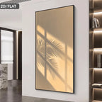 Framed artwork of palm leaves on a wall in a modern interior setting