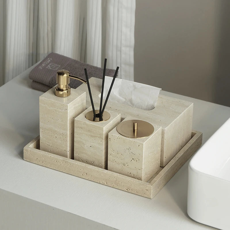 Bathroom accessories set on a tray with a neutral color scheme.