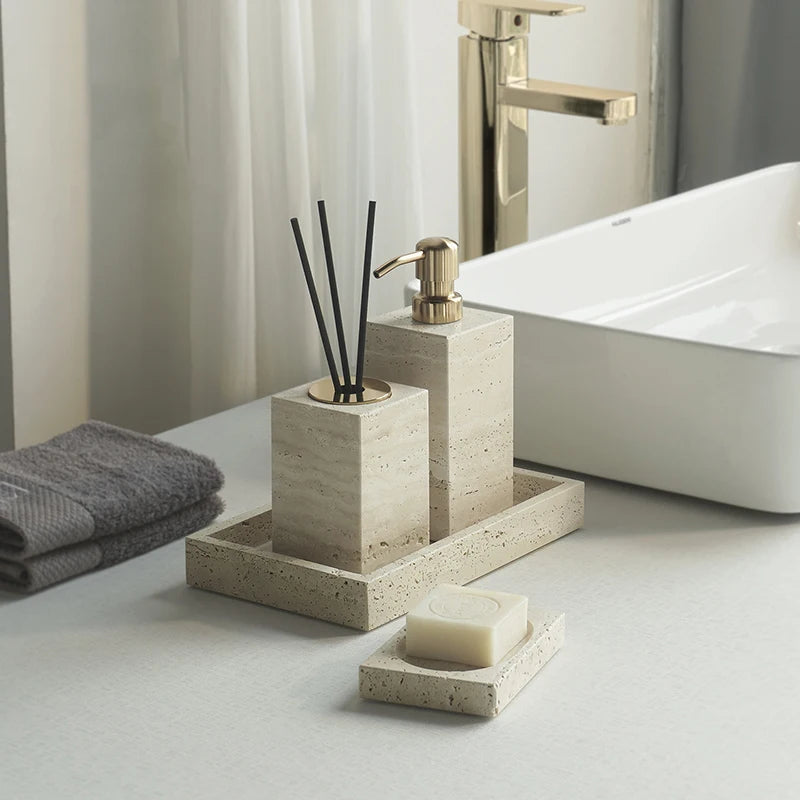 Bathroom setting with concrete holder, soap, and towel on a light surface.