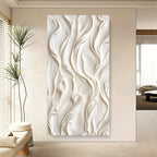 Abstract wall art with wavy patterns in a modern living room.
