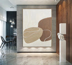 Modern interior with abstract art on a wall, dining area in the background