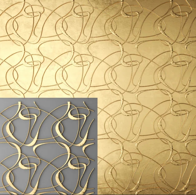 Decorative gold metal panel with abstract pattern on a textured surface.