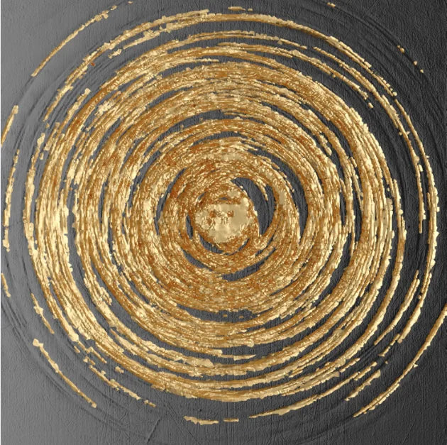 Decorative pillow with concentric gold circles on a dark background