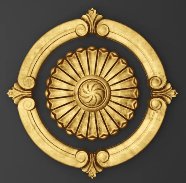 Decorative gold emblem with intricate design on a dark background