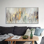 Living room with a large abstract painting above a gray sofa, wooden coffee table, and decorative items.