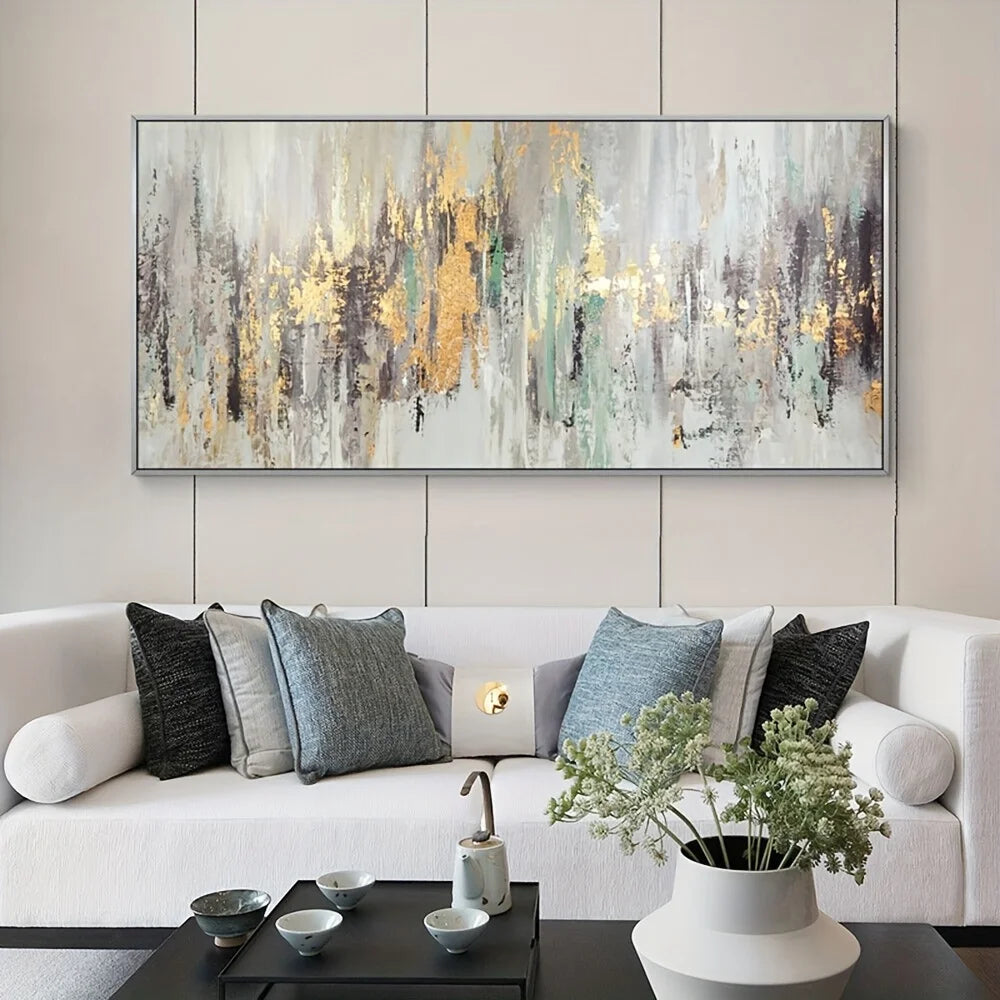 Living room with a white sofa, decorative pillows, a coffee table, and a large abstract painting on the wall.