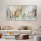 Living room with a large abstract painting on the wall above a sofa.
