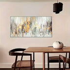 Abstract painting on a wall above a dining table with chairs.
