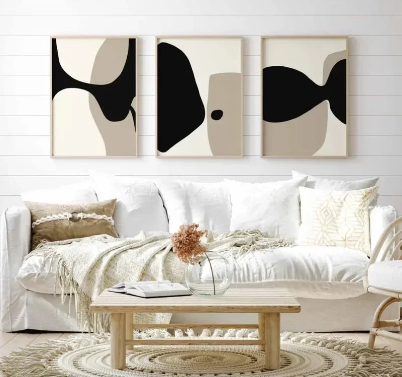 Modern living room with abstract wall art and a white sofa.