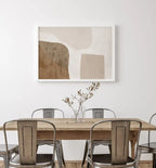 Dining room with wooden table and chairs, abstract art on the wall.