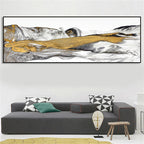 Modern living room with a large abstract painting above a gray sofa.