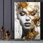 Abstract art piece with a woman's face and gold leaf on a dark surface