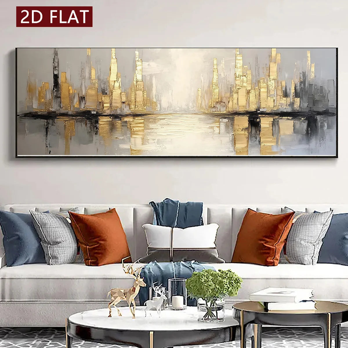 A wide rectangular abstract cityscape wall art piece in black, white, gray, and gold tones, displayed above a modern sofa in a styled living room. A red label in the top-left corner reads “2D FLAT.