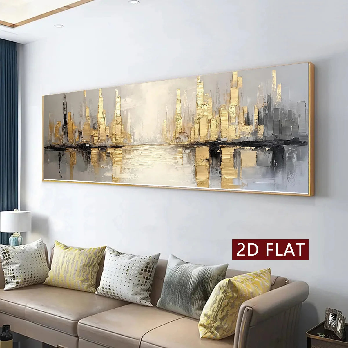A panoramic framed canvas print of a city skyline with gold and gray skyscrapers reflected in water, displayed on a light gray wall above a beige sofa with decorative pillows. A red label reads '2D FLAT'.