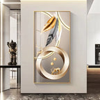 Decorative wall art with abstract design featuring feathers and a deer in a modern interior setting.