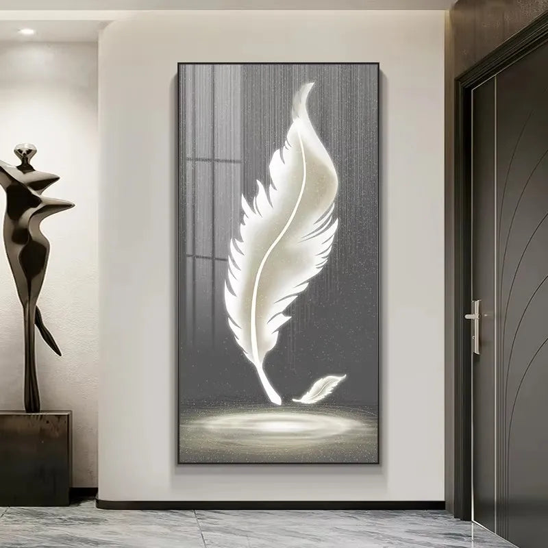 Decorative wall art of a white feather on a gray background in a modern interior setting.