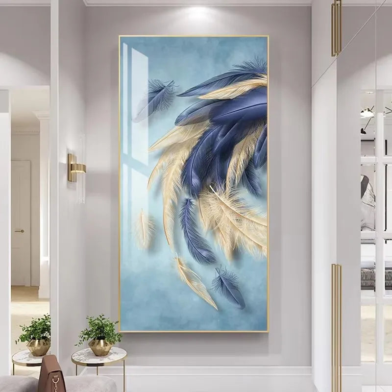 Decorative wall art with blue and gold feathers in a modern interior setting.