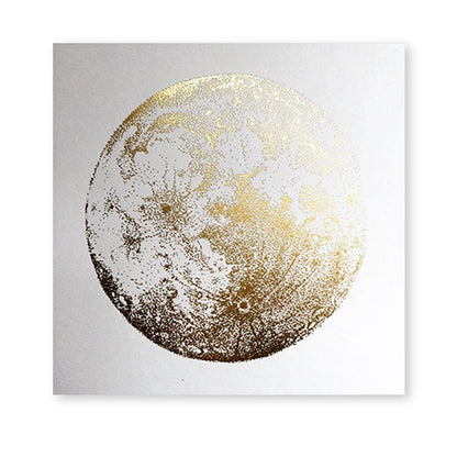 Framed artwork of a gold and white moon on a light gray background
