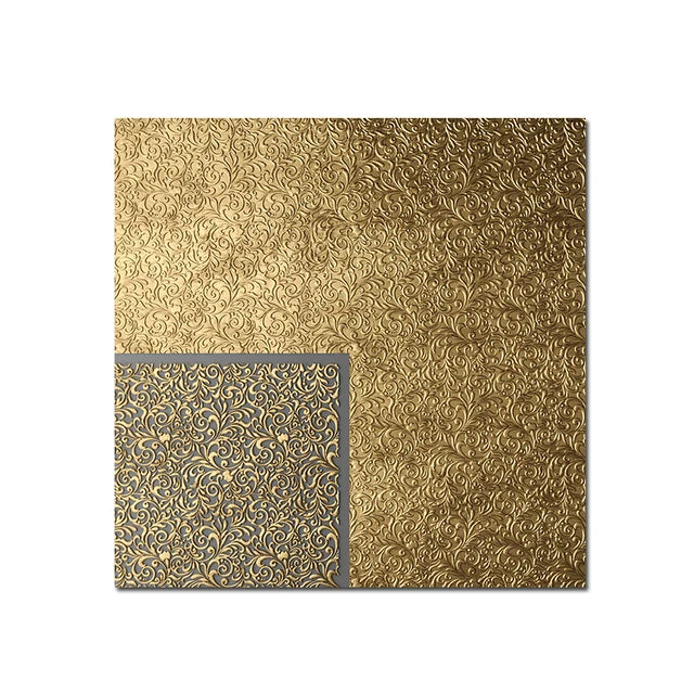 Gold embossed paper with decorative pattern on a white background