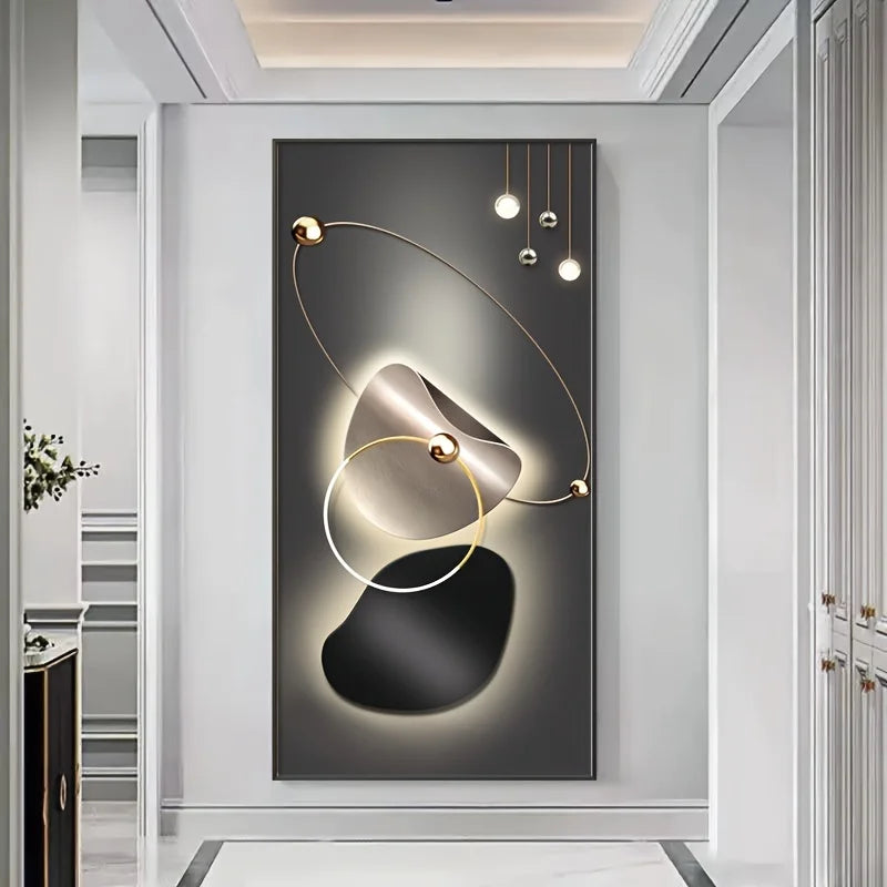 Modern wall art with abstract design and lighting fixture in a stylish interior setting.