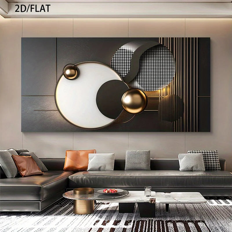Modern abstract wall art featuring black, white, and metallic gold geometric shapes, displayed above a contemporary gray sectional sofa in a styled living room setting.