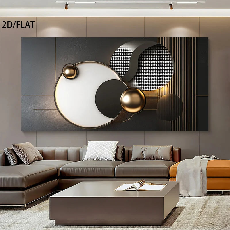 A large abstract wall art piece with black, white, gray, and metallic gold geometric shapes hangs above a modern sectional sofa in a styled living room. The artwork features bold circular and oval forms with metallic gold spheres and textured black-and-white patterned sections.