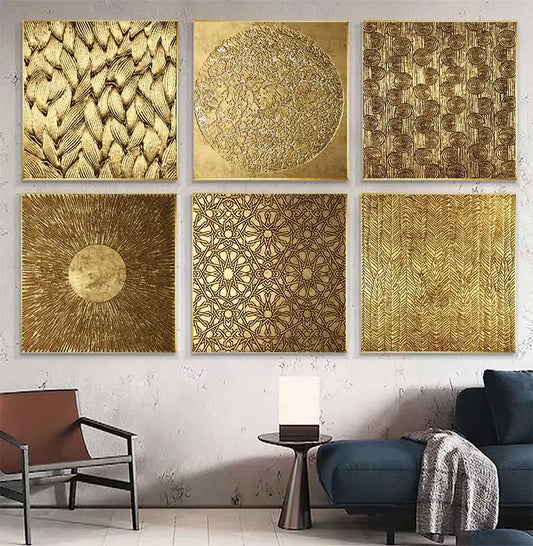 Set of six gold textured wall art pieces on a white wall with a modern interior setting.