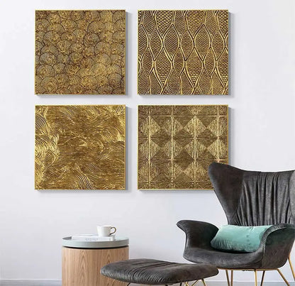 Four gold textured wall art pieces on a white wall with a modern chair and table in the foreground.