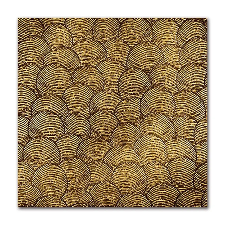 Patterned fabric with gold and black design on a white background