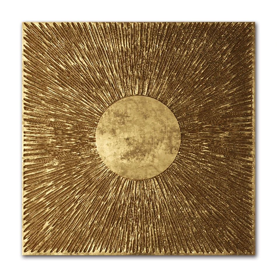 Decorative wall art with a gold sunburst design on a white background