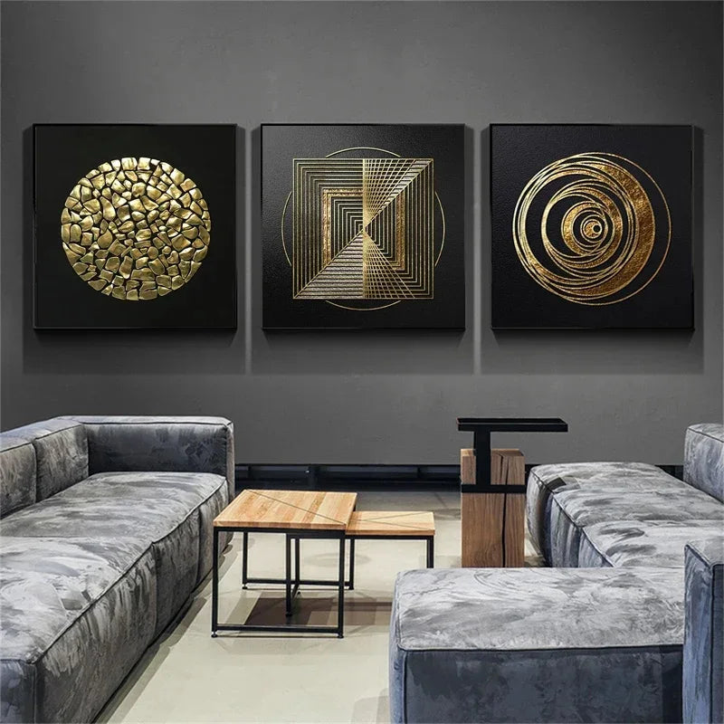 Three gold abstract wall art pieces on a gray wall above a modern living room setup.
