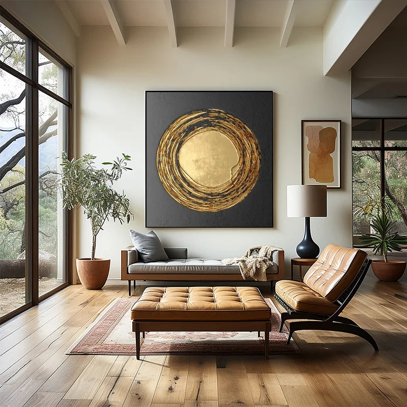Modern living room with a large abstract painting, leather chair, and ottoman.