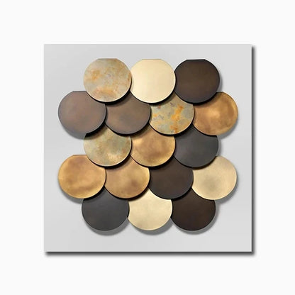 Decorative wall art with circular metal plates in gold, bronze, and black on a light gray background