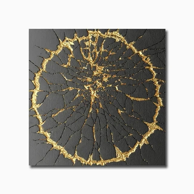 Decorative wall art with gold and black abstract design on a white background