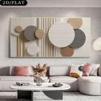 A large abstract wall art piece hangs above a light gray sectional sofa in a modern living room. The artwork features layered circular and oval forms in cream, beige, taupe, gray, and metallic gold tones on a light background.