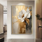 Abstract floral painting with white and gold flowers in a modern interior setting.