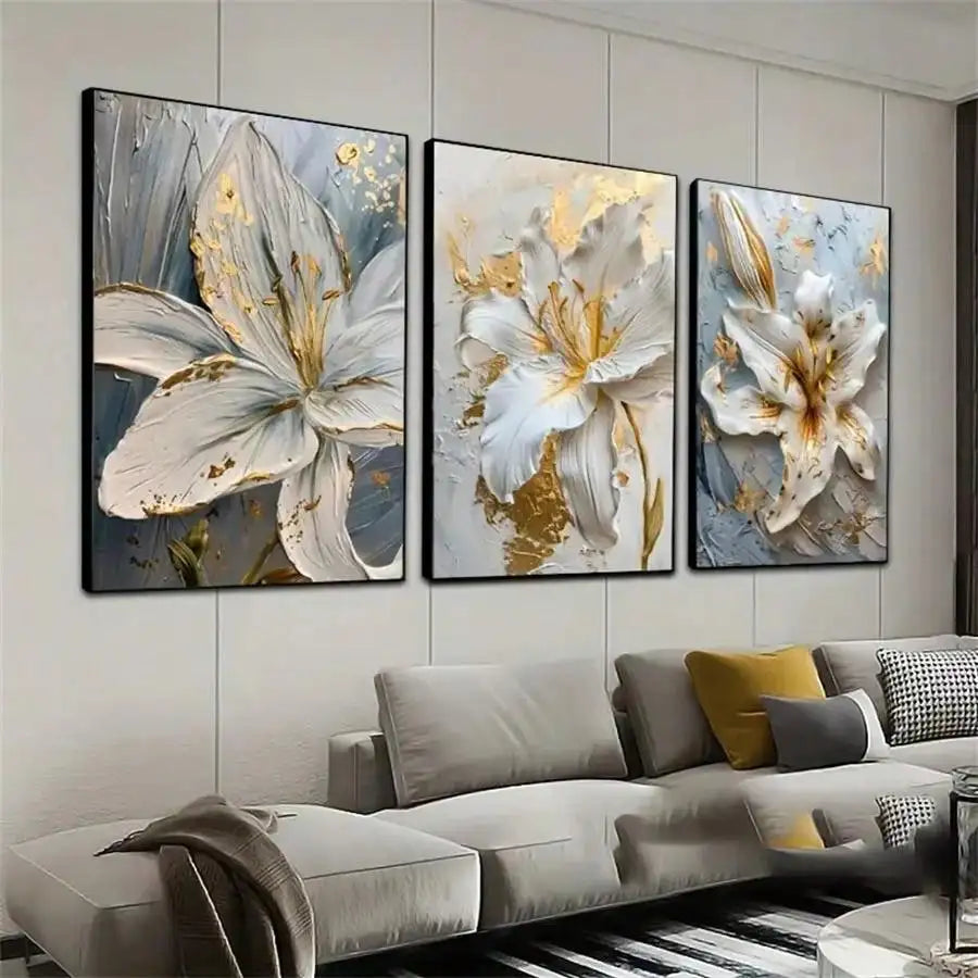 Three abstract floral paintings above a sofa in a living room.