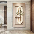Decorative wall art with abstract design and plant on a light wood floor.