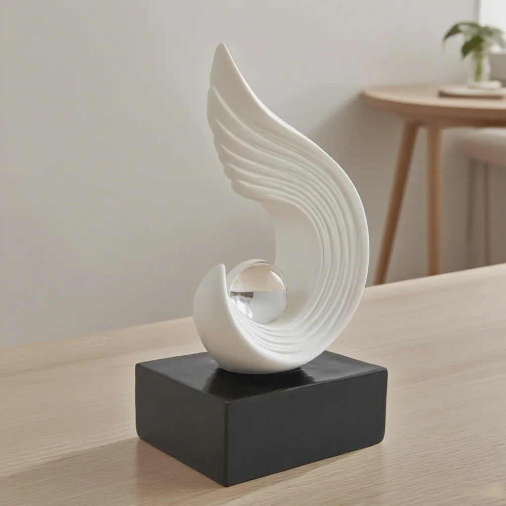 White abstract sculpture on a black base in a room setting