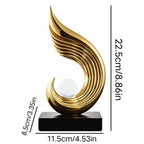 Gold decorative sculpture with measurements on a white background