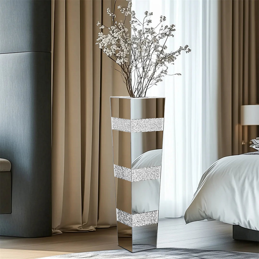 Decorative mirror with floral arrangement in a bedroom setting