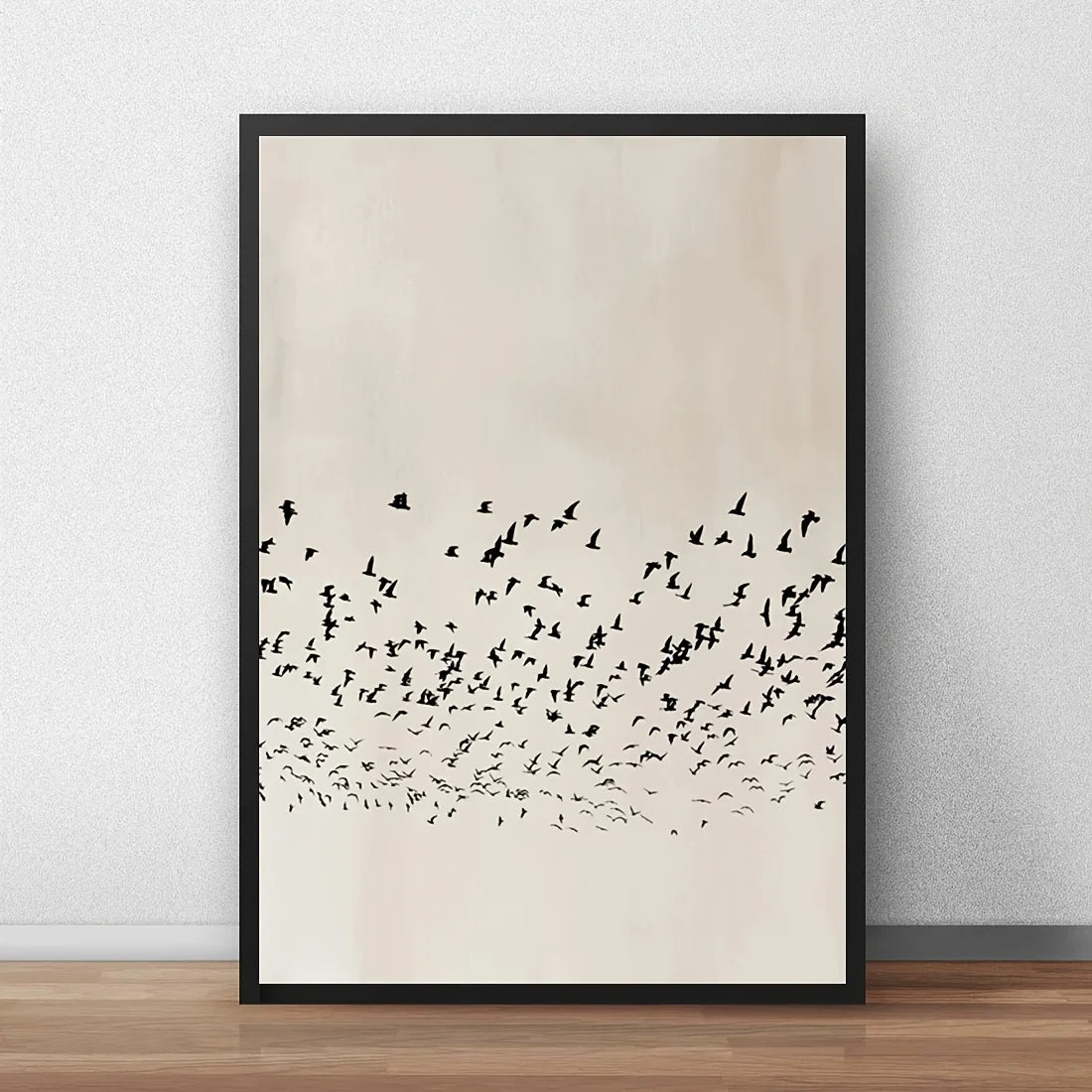 Framed artwork of a flock of birds on a beige background