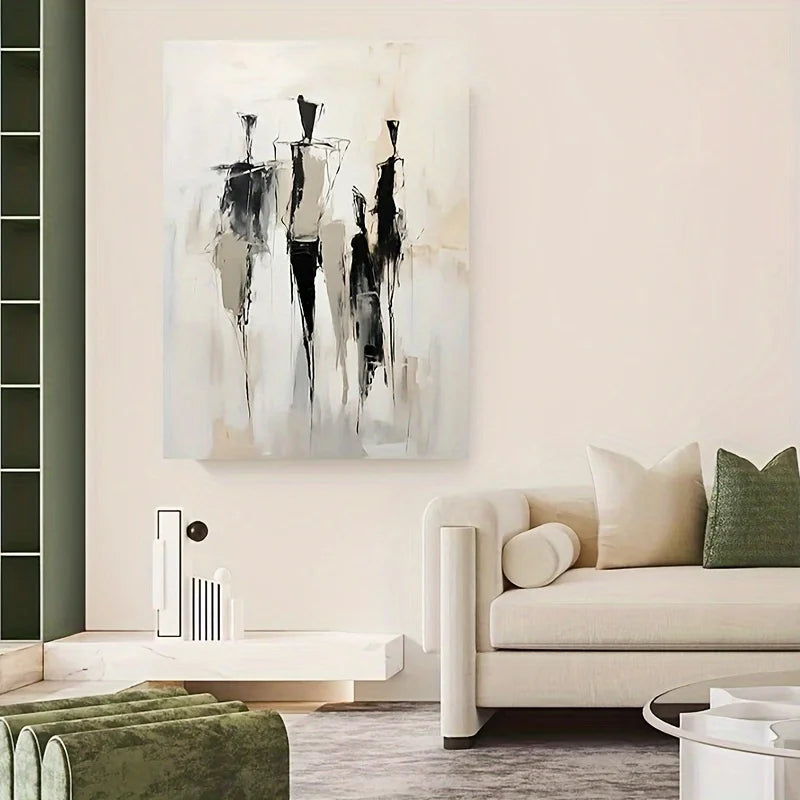 Modern living room with abstract art on the wall and a beige sofa.