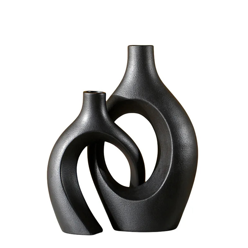 Black ceramic vase with a modern design on a white background